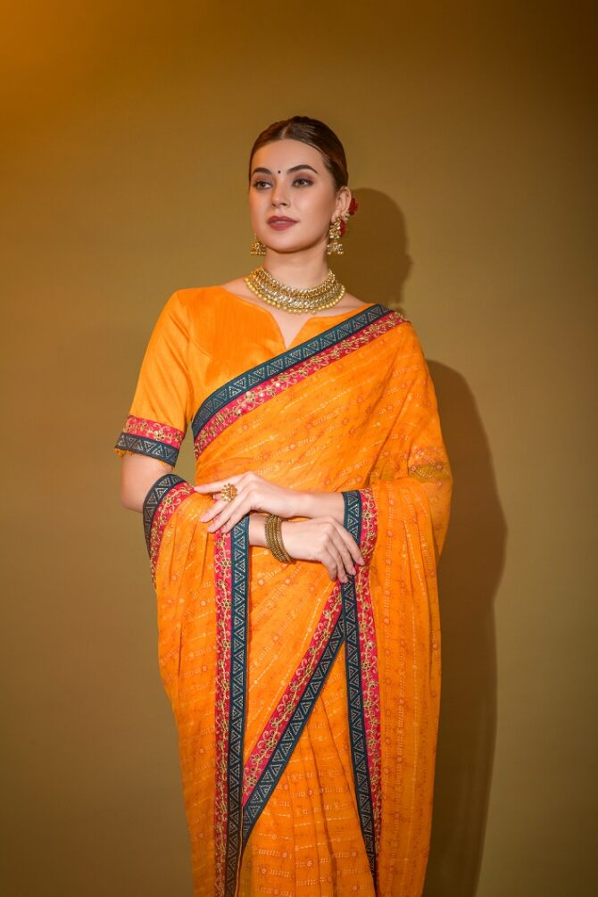 Mira Heavy Georgette Foil Print Work Saree (Orange)