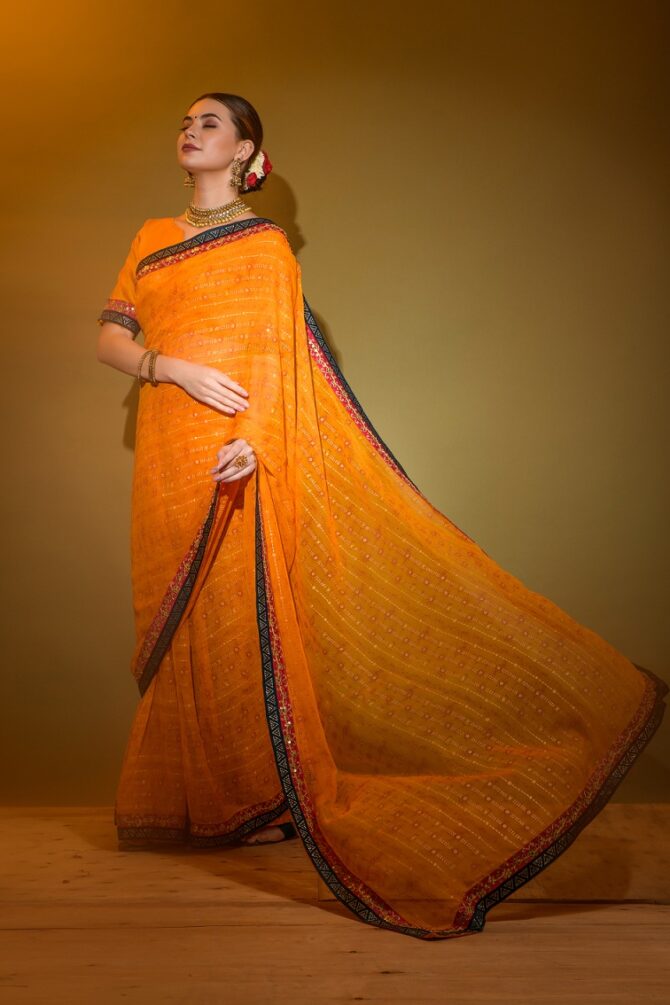 Mira Heavy Georgette Foil Print Work Saree (Orange)