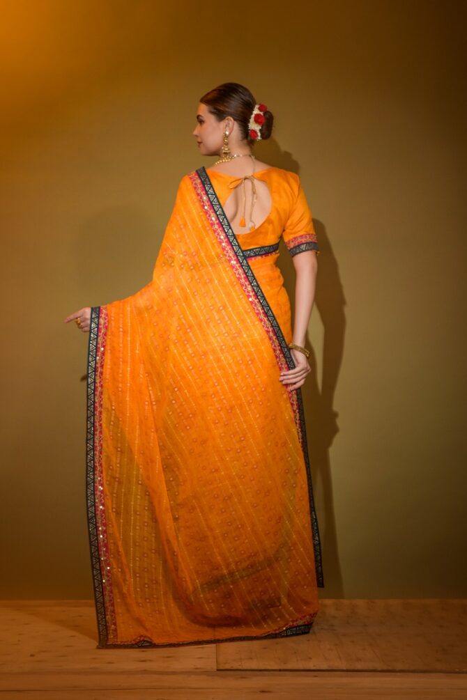 Mira Heavy Georgette Foil Print Work Saree (Orange)
